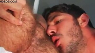 Licking two tasty asses.